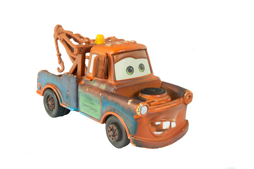 Adelaide, Australia - March 20, 2015: A studio shot of a Mater toy car from the Disney pixar movie Cars. Cars is an extremely popular animated movie with children worldwide.