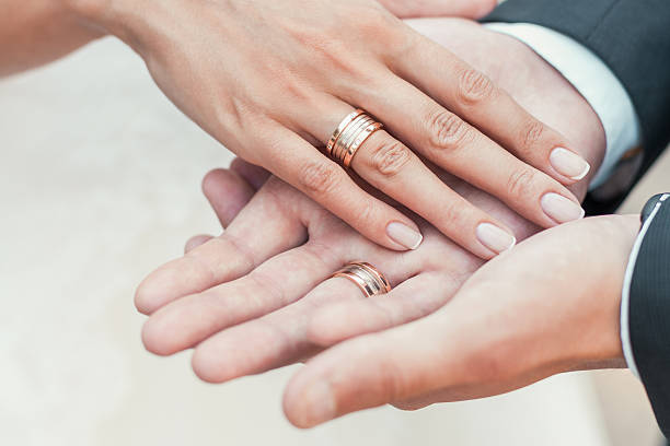 istock Groom holds the bride's hand in his hand 477961521