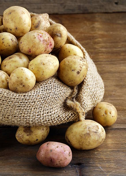 istock fresh organic potatoes on a wooden background 477962205