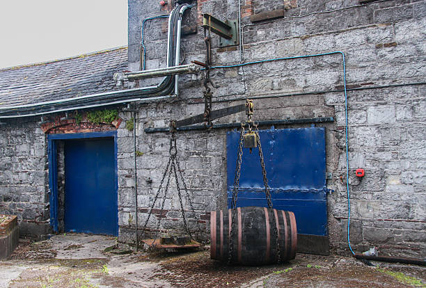 Cork, Ireland - June 20, 2008:  Old fashioned balance beam scale weighting barrel cask at the Jameson Heritage Centre  in Midleton Co. Cork, 12 miles east of Cork City on the main Cork Waterford Road.