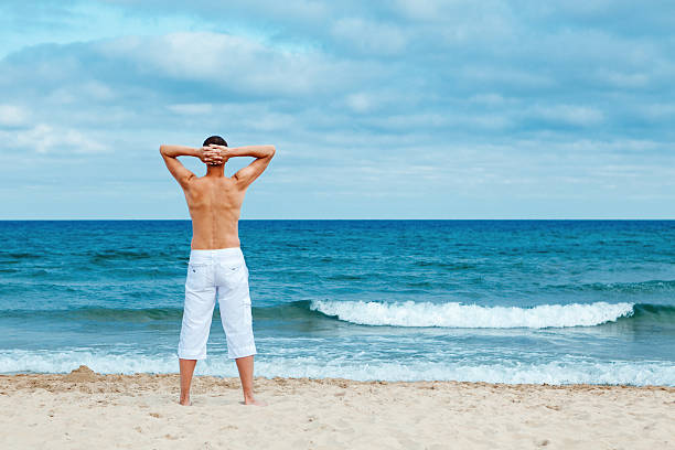 istock Portrait of man on beach 477963413