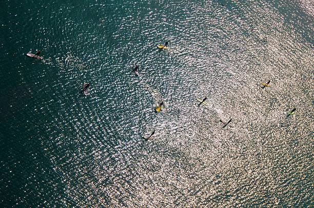 Torbole, Italy - September, 5. 2019: Some windsurfer in front of Torbole in Italy. Torbole is located at Lake Garda and very famous for surfing.