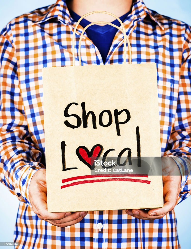 Mężczyzna promowanie sklepów lokalnych - Zbiór zdjęć royalty-free (Handel detaliczny)