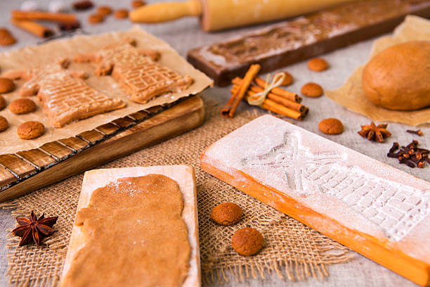 istock Baking Dutch speculaas cookies with authentic wooden cookie cutters 477965517