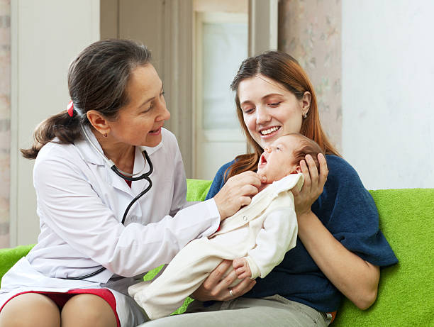 istock friendly mature pediatrician doctor examining newborn 477966343