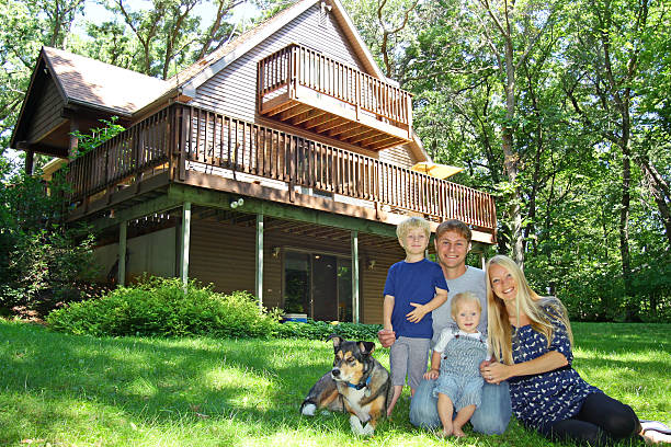 istock Happy Family at Cabin in Woods 477967145