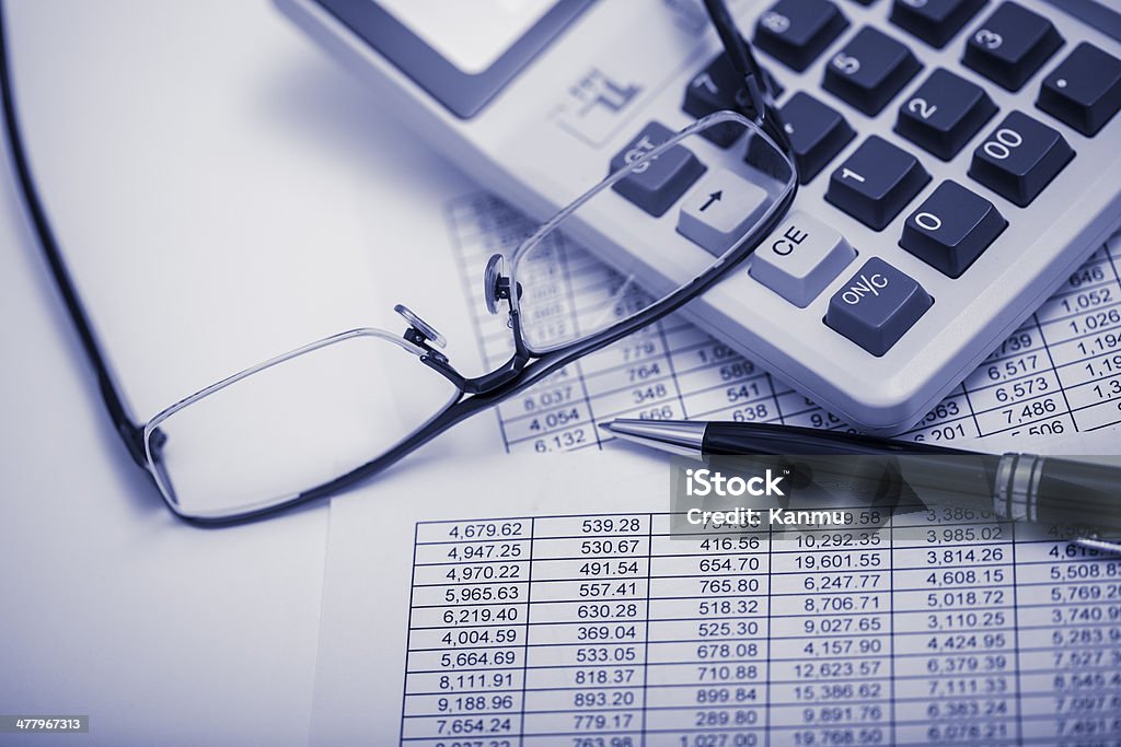 financial results Pen, calculator,glasses,  financial reporting Black And White Stock Photo