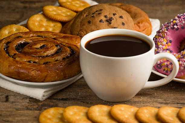 istock Cup of coffee on a wooden board and biscuits 477969416