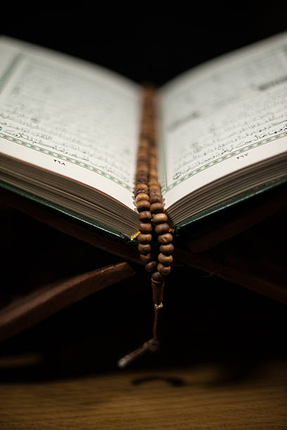 istock Open Quran resting on a stand ready to be read 477970073