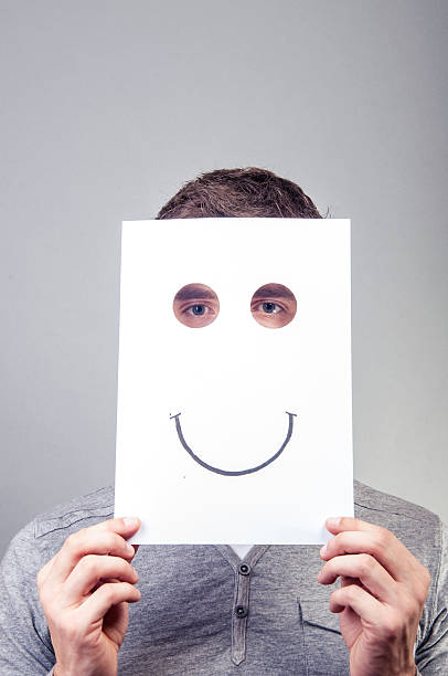 istock Man hold paper with emotions 477971559