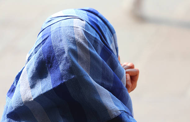 istock Arab woman with veil in town 477972598