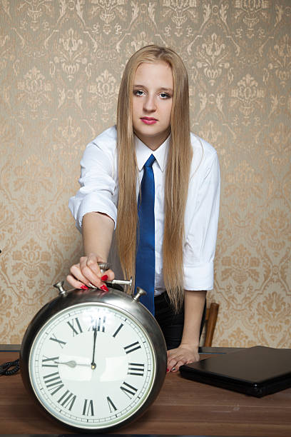 istock business woman with the clock 477973276
