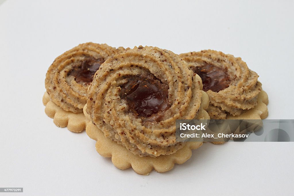 Biscuit with jam filling in the centre Delicious short-bread biscuits filled with jam. Baked Stock Photo