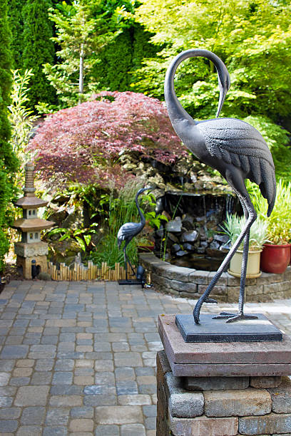 istock Bronze Cranes in Japanese Inspired Garden 477973705
