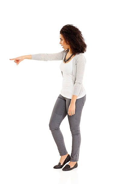 istock Young African lady pointing away at copyspace 477974143