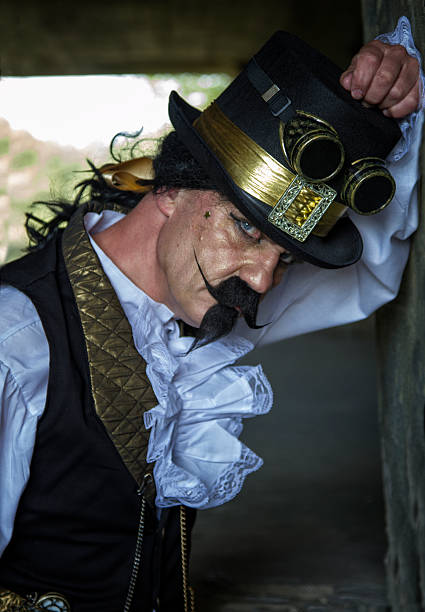 istock Middle aged man posing in Steampunk costume 477977686