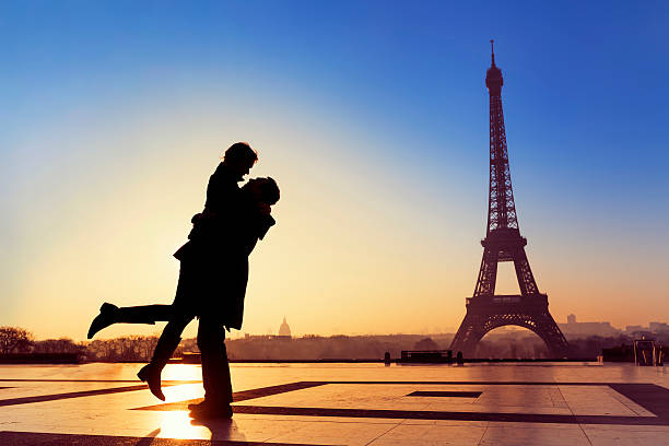 istock Young couple in love at Eiffel Tower 477977692