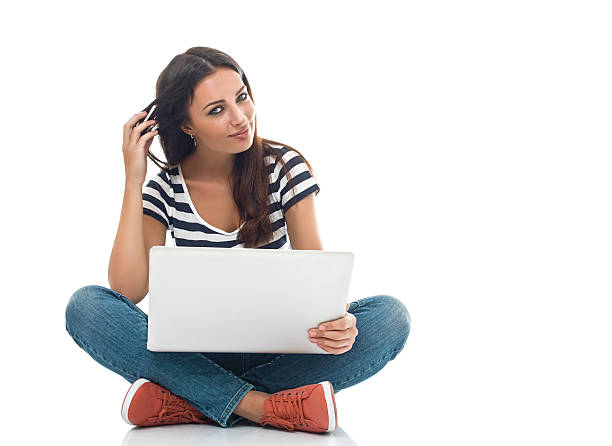 istock Young beautiful woman using laptop 477978645