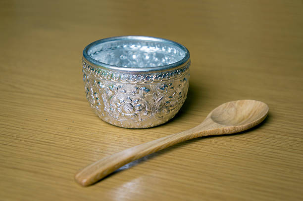 istock Silver bowl with wooden spoon. 477978784