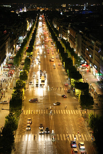 istock Champs Elysees by night with moving traffic 477979986