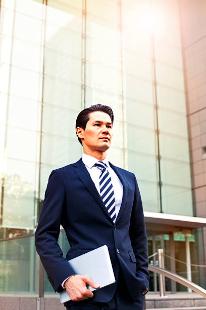 istock Japanese businessman using digital tablet, Tokyo. 477980752