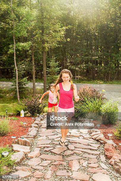 Two Sisters Runs To The House Stock Photo - Download Image Now - 10-11  Years, 12-13 Years, 14-15 Years - iStock