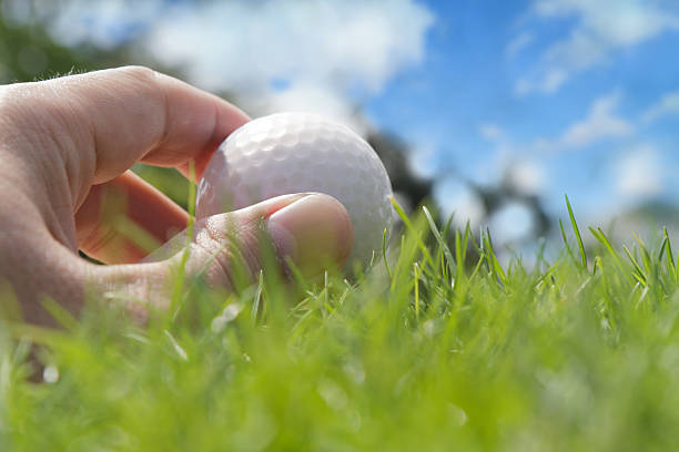 istock Golfer putting a ball on the green 477981831