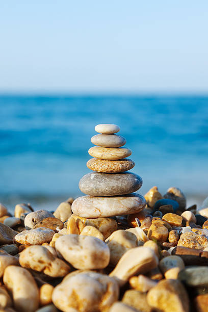 istock Stacked pebbles on the sea side 477983616