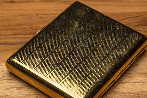 Photo of Scratched and Worn Old Fashioned Cigarette Case