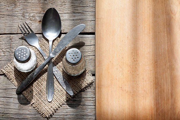 istock Cutlery and vintage empty cutting board 477984955