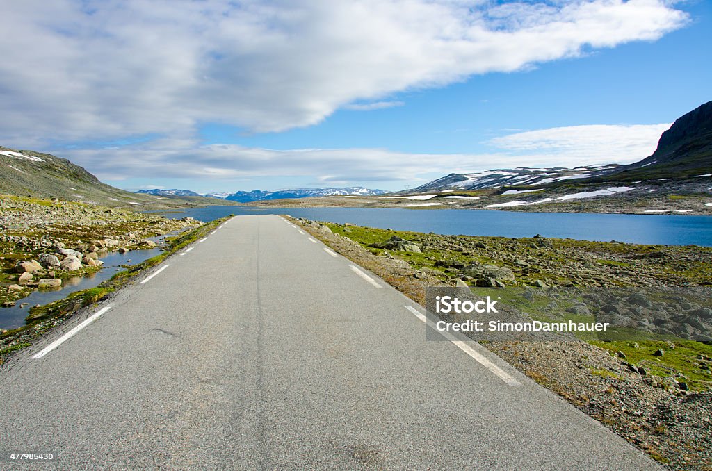 Road through the high land of Jotunheimen Highland of Norway in the mountains of Jotunheimen National Park 2015 Stock Photo