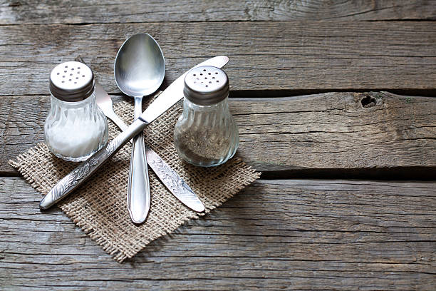 Cutlery kitchenware on old wooden boards