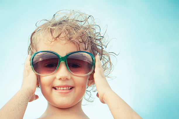 istock little girl with sunglasses 477987790