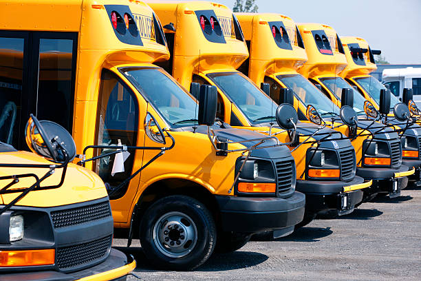 istock New School Buses in line ready for shipment. 477987965