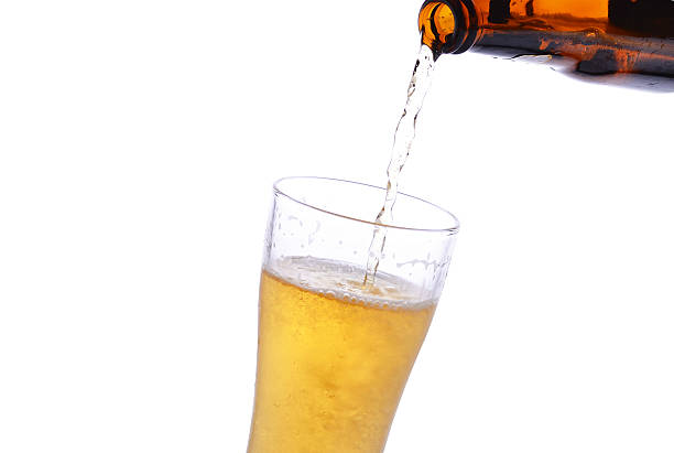istock Pouring beer from bottle to stein 477988866