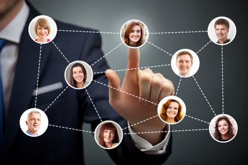 Businessman touching button with social networking people