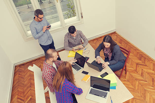 istock Young group of people discussing business plans 477990238