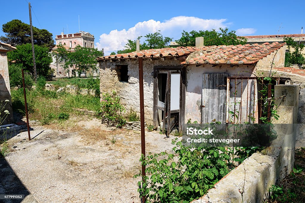 Old  outhouse and garden on Pianosa Island, Italy Old  outhouse and garden on Pianosa Island, Italy. Pianosa was the Prison island of the Tyrrhenian, and is now a national park. No people. 2015 Stock Photo