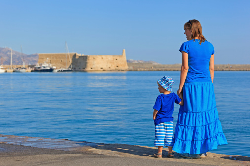 tourist family looking at old fortress in Heralklion, Crete