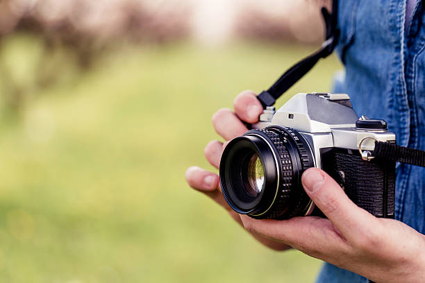 istock Female photographer in a park 477992537