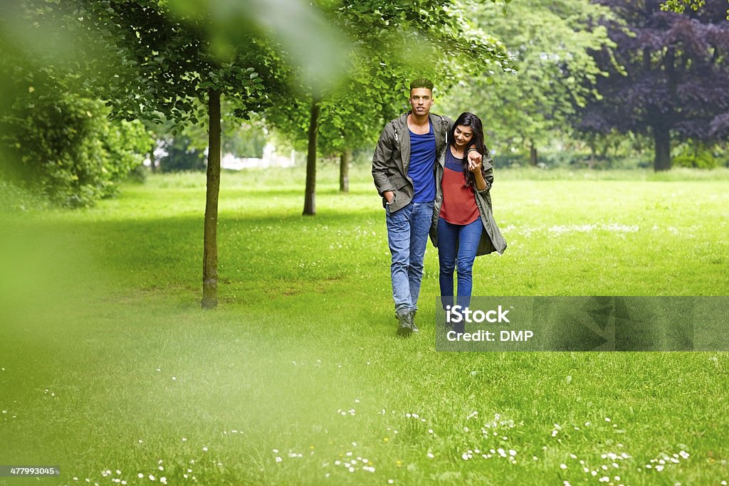 Romantic young couple walking in park Portrait of romantic young couple walking in park - Outdoor 20-24 Years Stock Photo
