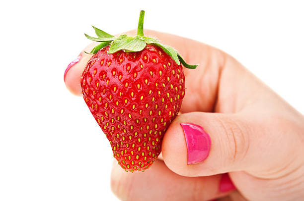 istock woman holding strawberry 477993231