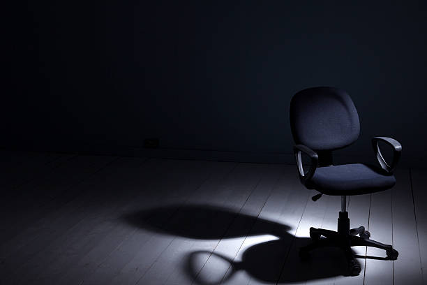 istock Office Chair Under The Spotlight 477994171