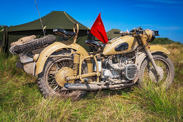 istock Old military motorcycle in desert camouflage 477995352