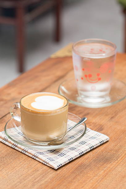 istock close up a cup of coffee on wooden table 477996463