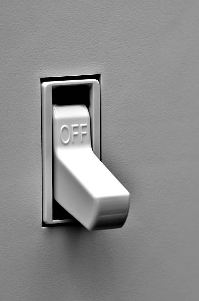 Light Switch in Off Position Light switch on wall inside a home in off position light switch photos stock pictures, royalty-free photos & images