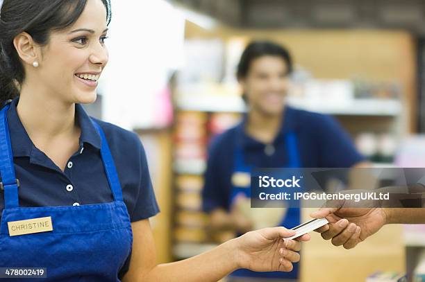 Handing Loyalty Card In Supermarket Stock Photo - Download Image Now - Cashier, Supermarket, Occupation