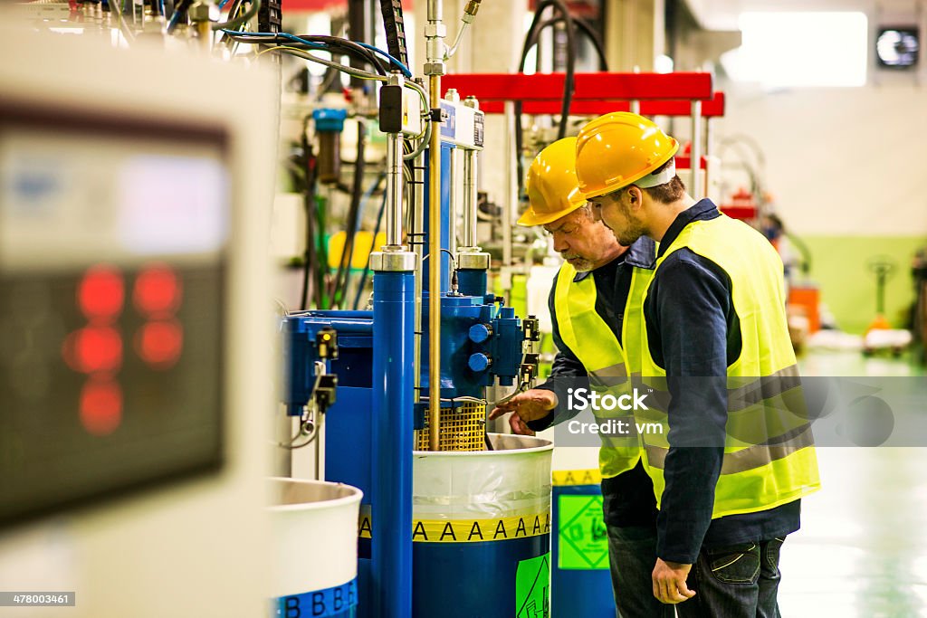 Foreman und Arbeiter in der Fabrik - Lizenzfrei Herstellendes Gewerbe Stock-Foto