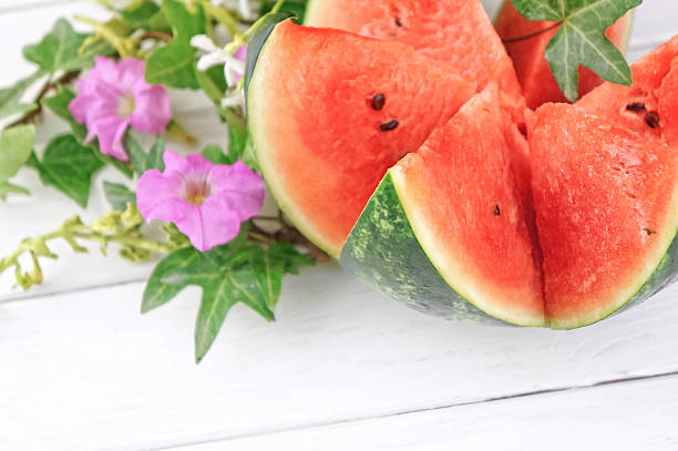 istock Fresh watermelon on white wooden table 478003520