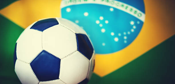 istock brazil flag background with soccer ball 478003679